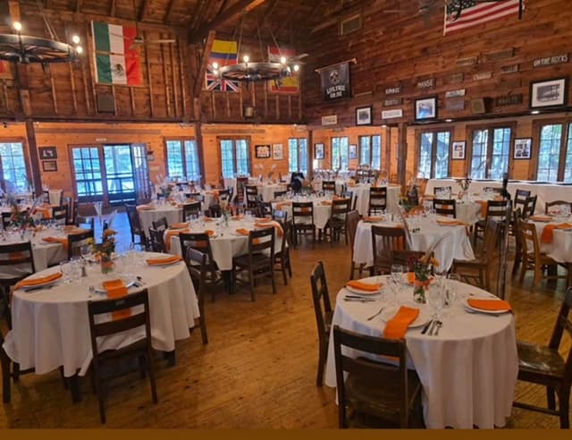 Dining hall set for dinner at Camp Nakamoto